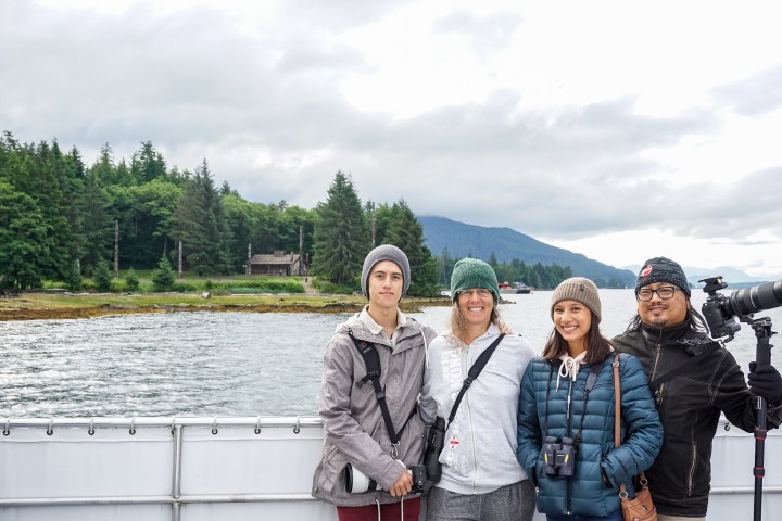 A family takes advantage of our photo opportunity at Totem Bight State Historical Park.