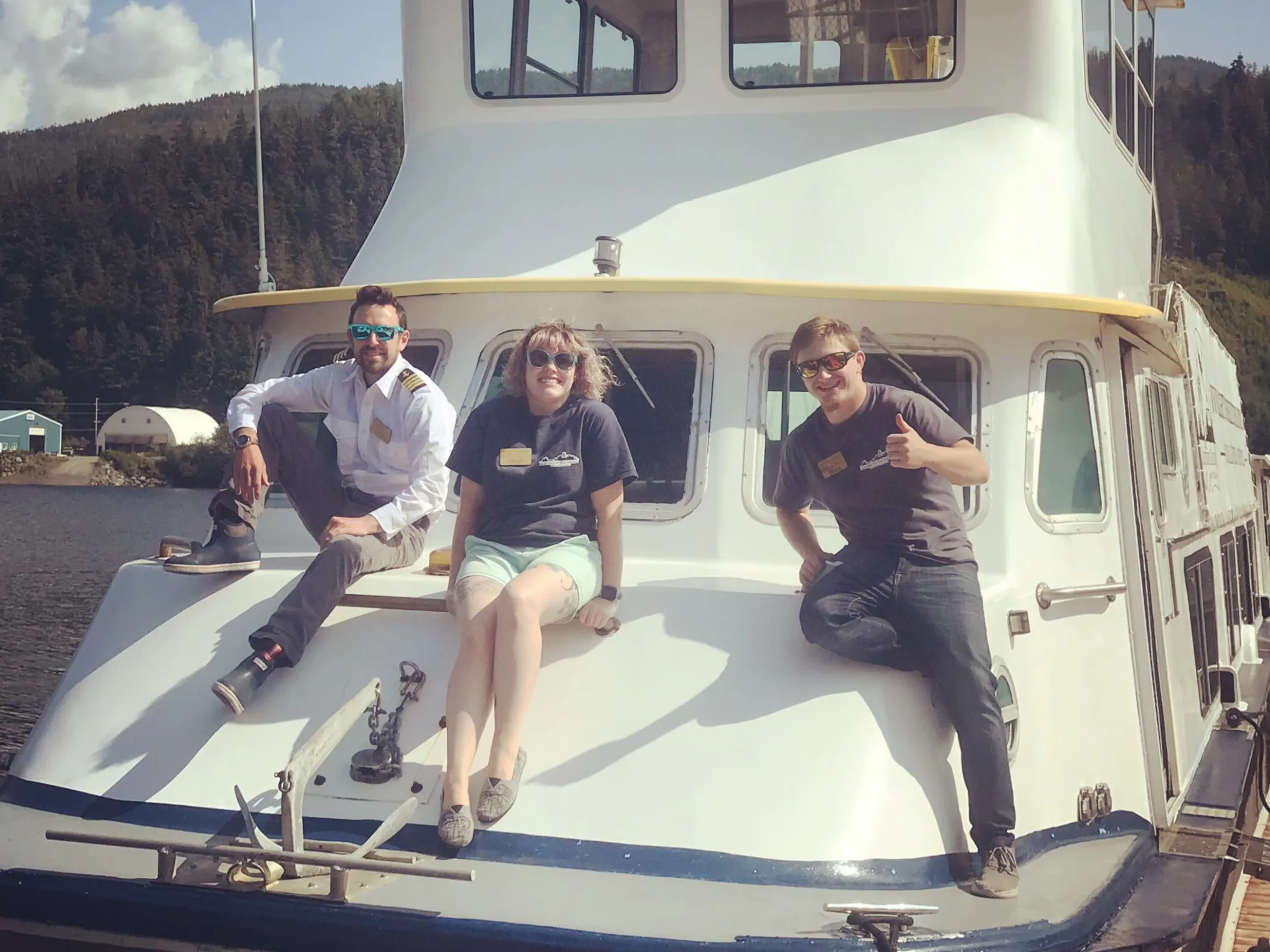 a group of people standing on a boat